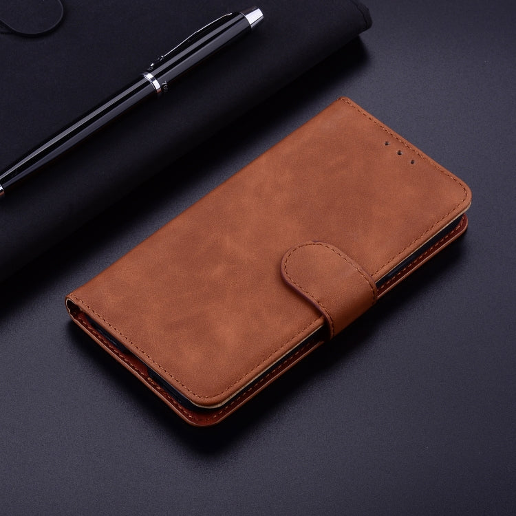 For iPhone 16e Skin Feel Pure Color Flip Leather Phone Case(Brown) - iPhone 16e Cases by PMC TechLife | Online Shopping South Africa | PMC TechLife | Buy Now Pay Later Mobicred