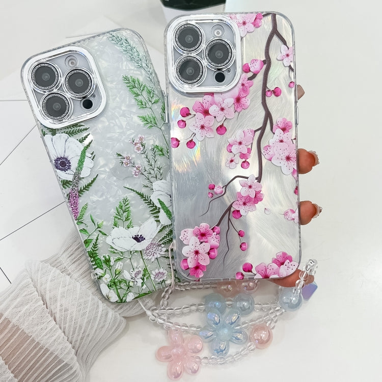 For iPhone 16e Electroplating Flowers Plants Texture Wristband TPU Phone Case(Blue Flower FL13) - iPhone 16e Cases by PMC TechLife | Online Shopping South Africa | PMC TechLife | Buy Now Pay Later Mobicred