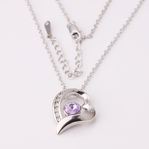 A striking 18K gold plated heart pendant necklace featuring a sparkling purple stone, elegantly crafted in silver color and adorned with beautiful crystals.