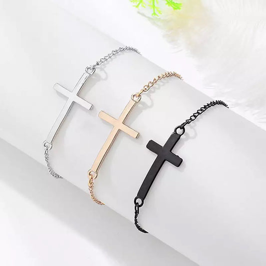 A stylish unisex cross bracelet made of high-quality materials, perfect for everyday wear. Featuring a simple design with a silver-tone cross in the center, this bracelet is adjustable to fit most wrist sizes. Ideal for fashion-forward individuals looking for a versatile accessory that can be worn alone or stacked with other bracelets. Get yours today and add a touch of elegance to any outfit!